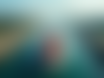 Eye-level view of the Panama Canal's locks with a cargo ship passing through