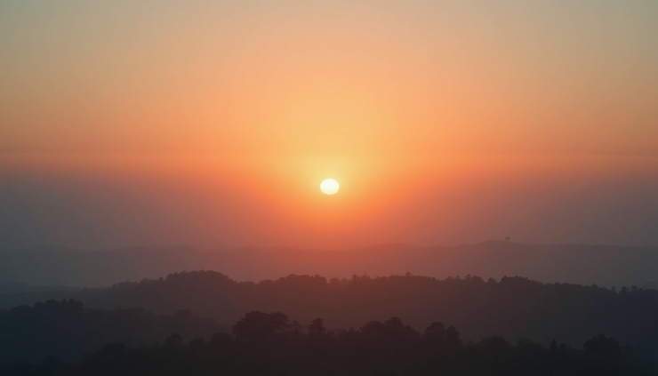 Eye-level view of the sun rising over a misty horizon, symbolizing the emergence of truth