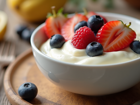 Close-up view of a bowl of creamy yogurt topped with fresh fruits