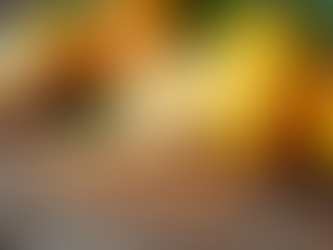 Close-up view of fresh citrus fruits and seeds on a wooden table