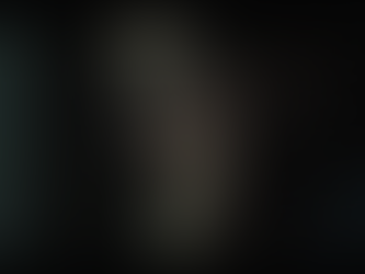 Eye-level view of a shadowy figure whispering secrets in a dimly lit room