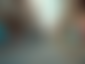 Eye-level view of a deserted street with graffiti on the wall