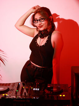 DJ Ibiza performing a house and commercial DJ set at a club or live event.