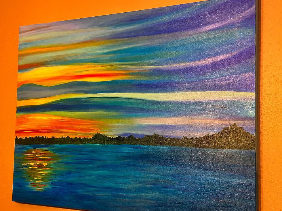 Close-up view of a framed landscape painting hanging on a wall