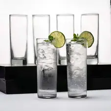Set of six tall glasses with ice and lime