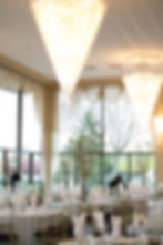 A view of our Victoria in the Park banquet hall on a bright sunny day, the sun shining through the tall glass windows.