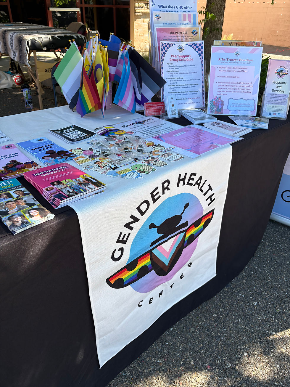A colorful table with the Gender Health Center's logo and resource materials. 