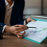 person-office-analyzing-checking-finance-graphs.jpg