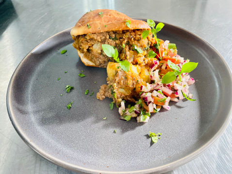 Vetkoek with Sweet and Sour Mince Curry and Tomato Sambal 