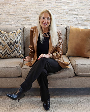 Cherl_Kuhlman_of_CK_Designs_sitting_on_cropped_couch.jpg