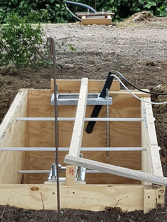 Foundation box with timber shuttering (because the soil was loose) with templates attached