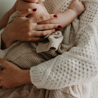 Woman holding healthy baby 