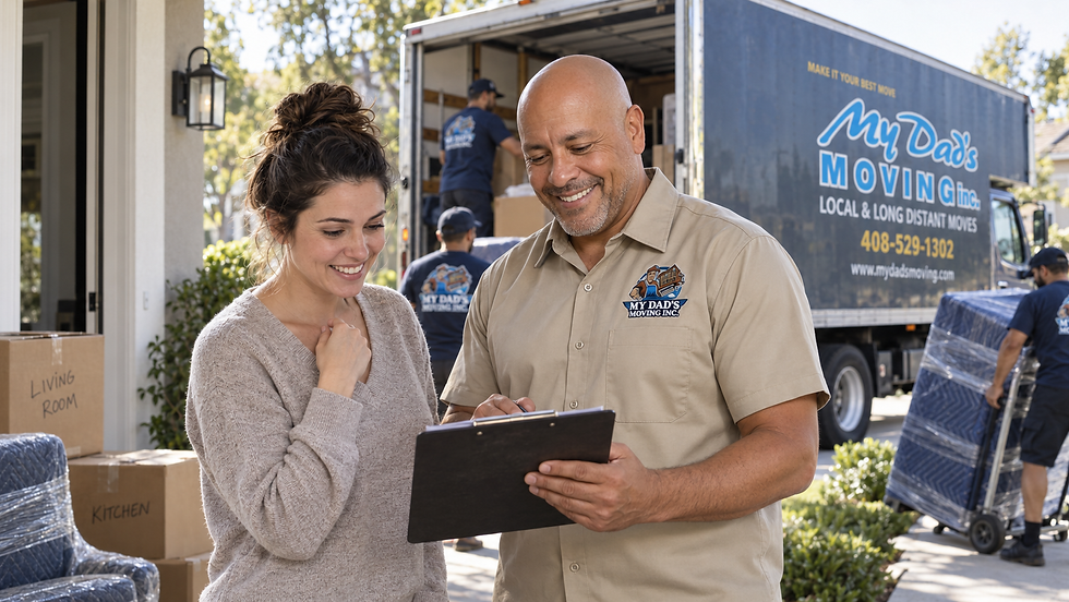 Happy homeowner standing with Rick Lopez Jr. during a residential move as My Dad’s Moving Inc. crew members load wrapped furniture and boxes into a branded moving truck.