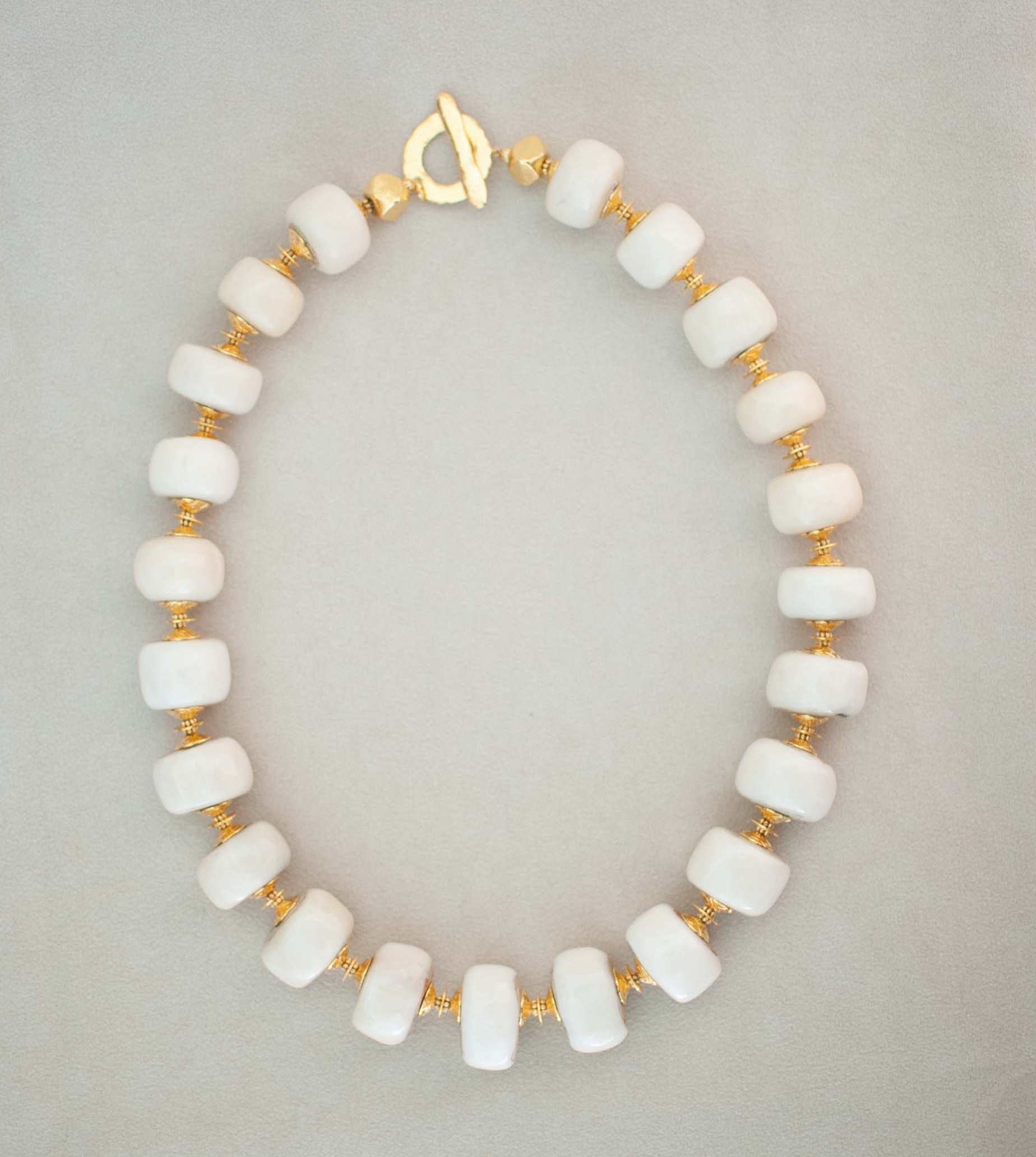 64. Polished Bone Disks with Vermeil Accents