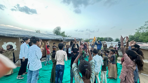 Happy learners are all smiles as they watch Dr. Sharwan Saini.