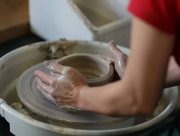 Clay to Creation pottery wheel throwing class for hands-on learning and creativity.