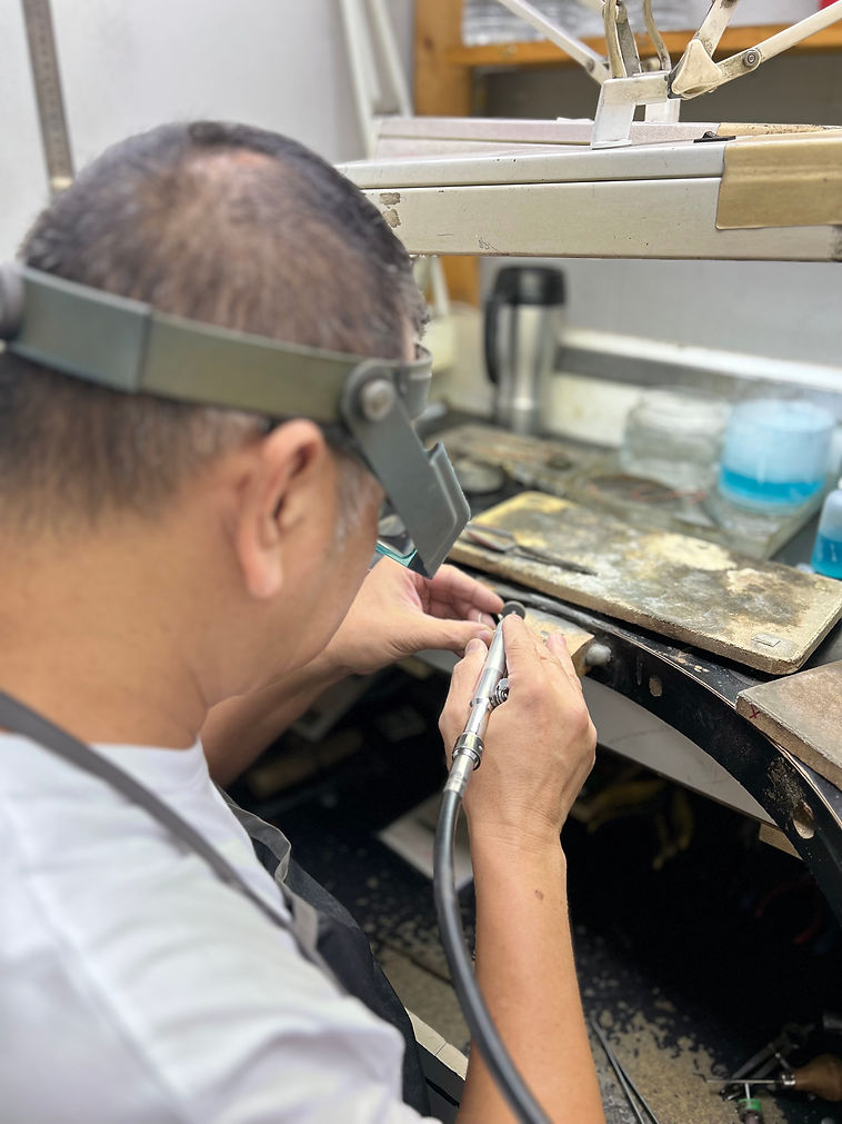 Bench worker polishing a ring