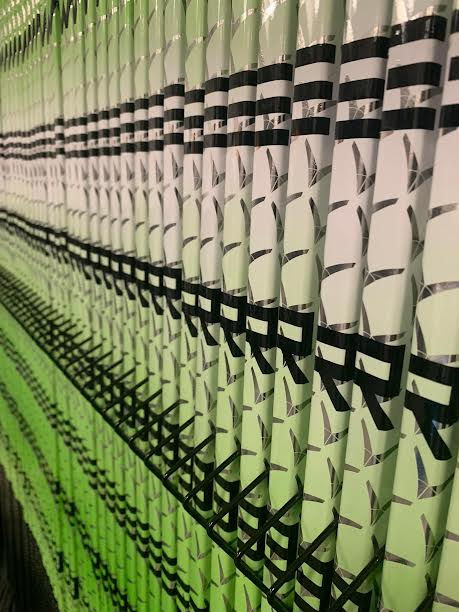 Repeating pattern of green and white objects with 'RR' text