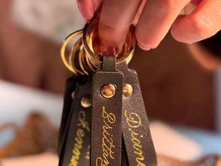 black leather keychains with gold foiled calligraphy