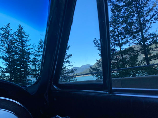 Lake and mountains from car window