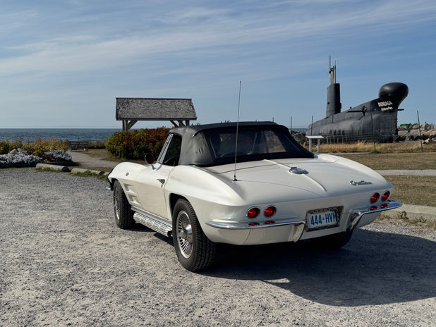 White vintage convertible car by submarine
