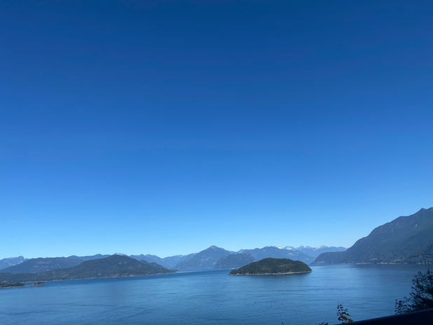Scenic lake with islands and distant mountains