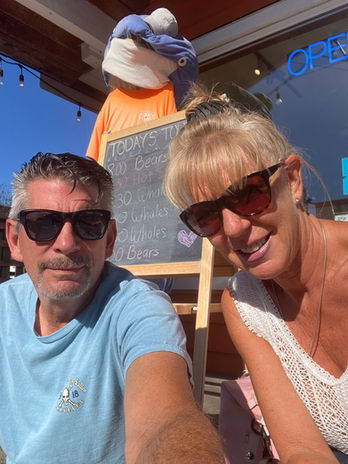 Smiling couple outdoors in sunglasses