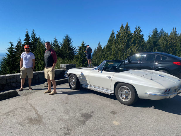 Friends with a classic white convertible on an adventure