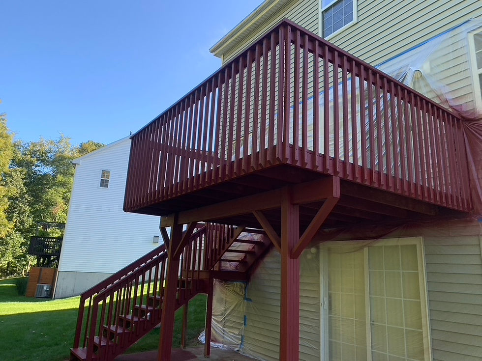 Multi-level red deck with stairs on a house
