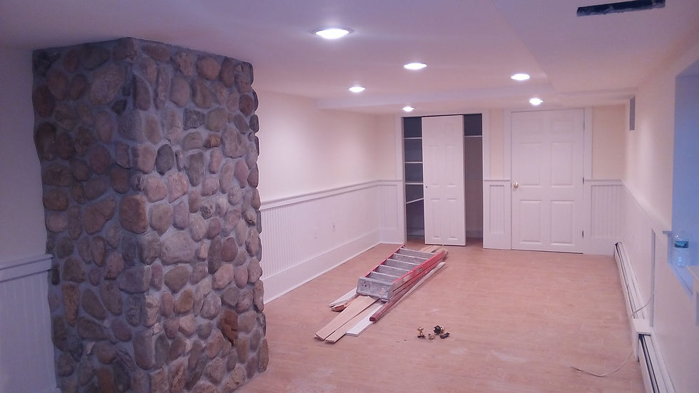 Renovated room with stone pillar and recessed lighting