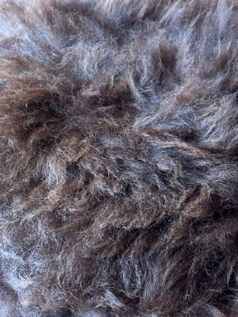 Thumbnail: dark brown sheepskin stool detail