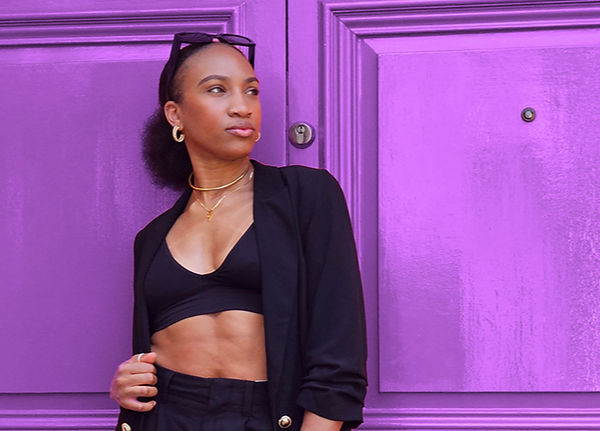 Female Professional in front of purple door