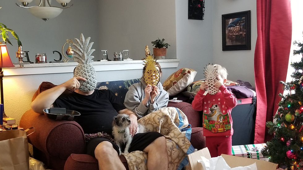 eye level photography of a family being silly at christmas