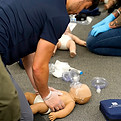 Student CPR on Infant manikin during a hands on training session in Snohomish County, WA
