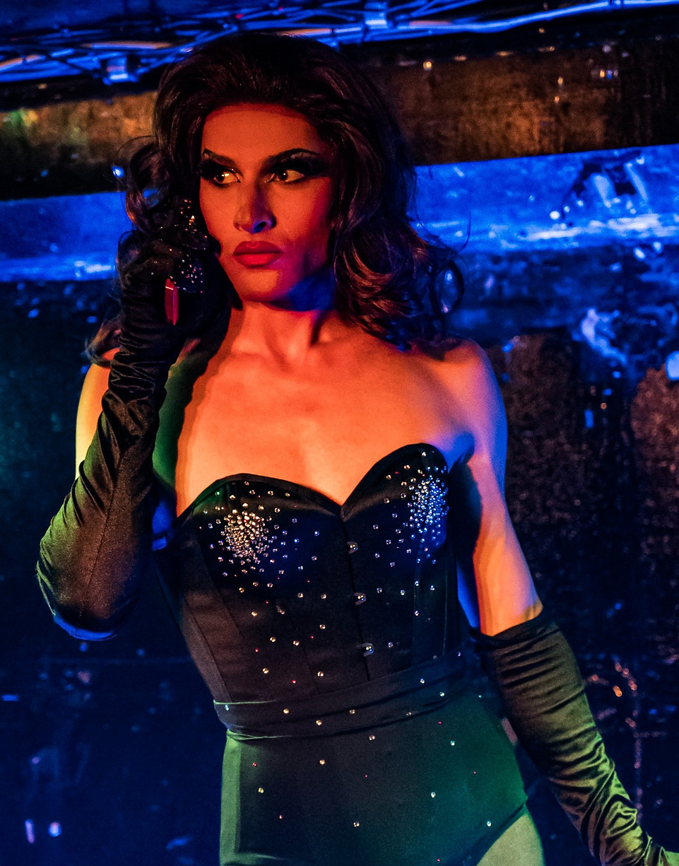 a drag queen singing 