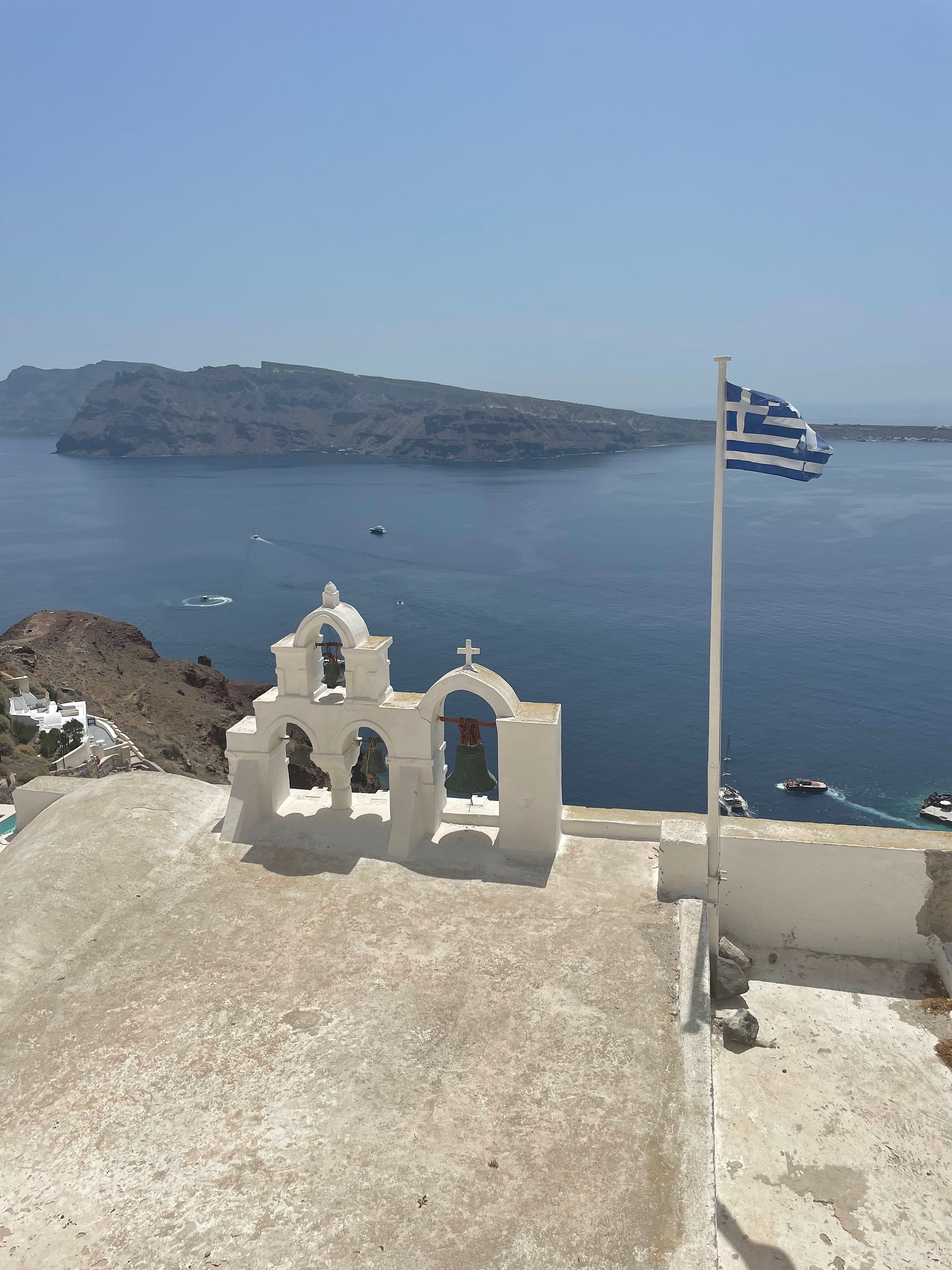 Greece, Santorini, Oia, caldera, Aegean Sea, white cliff side, greek flag, 