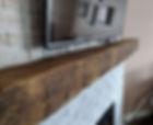 Reclaimed hand hewn fireplace mantel