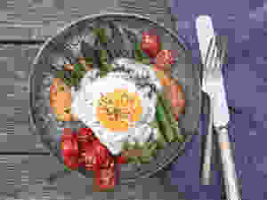 asparagus with an egg on it