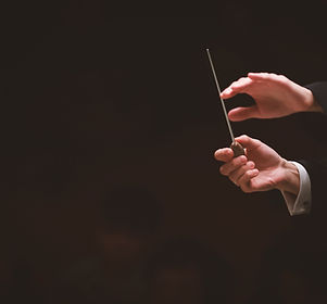 Cropped Image Of Conductor In Orchestra