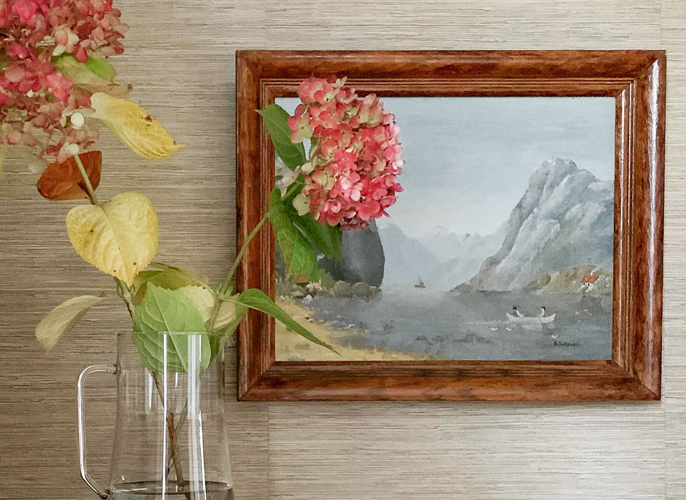 grasscloth wallpapered nook with vintage oil painting