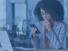 Office employee monitoring online engagement on a mobile phone