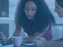 Manager reviewing employee social media activity in the workplace