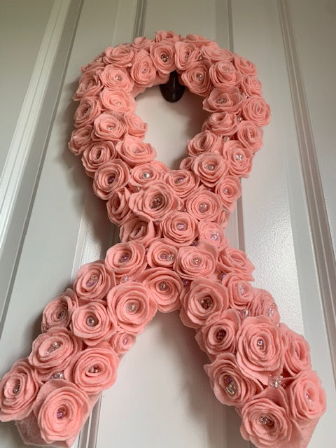 Thumbnail: Pink felt rosette cancer awareness wreath