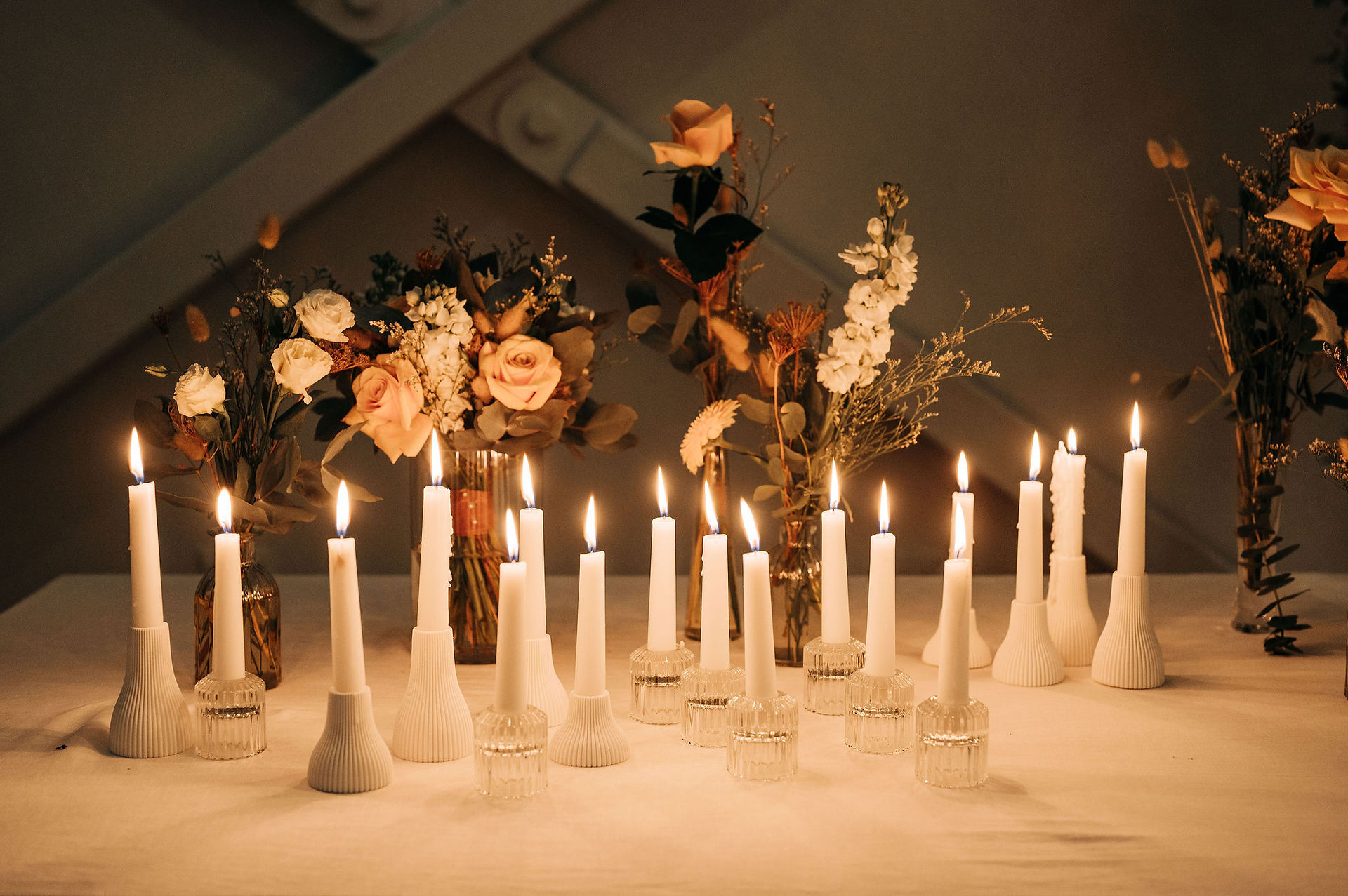 Welder Events - seated Wedding Reception candles and florals 