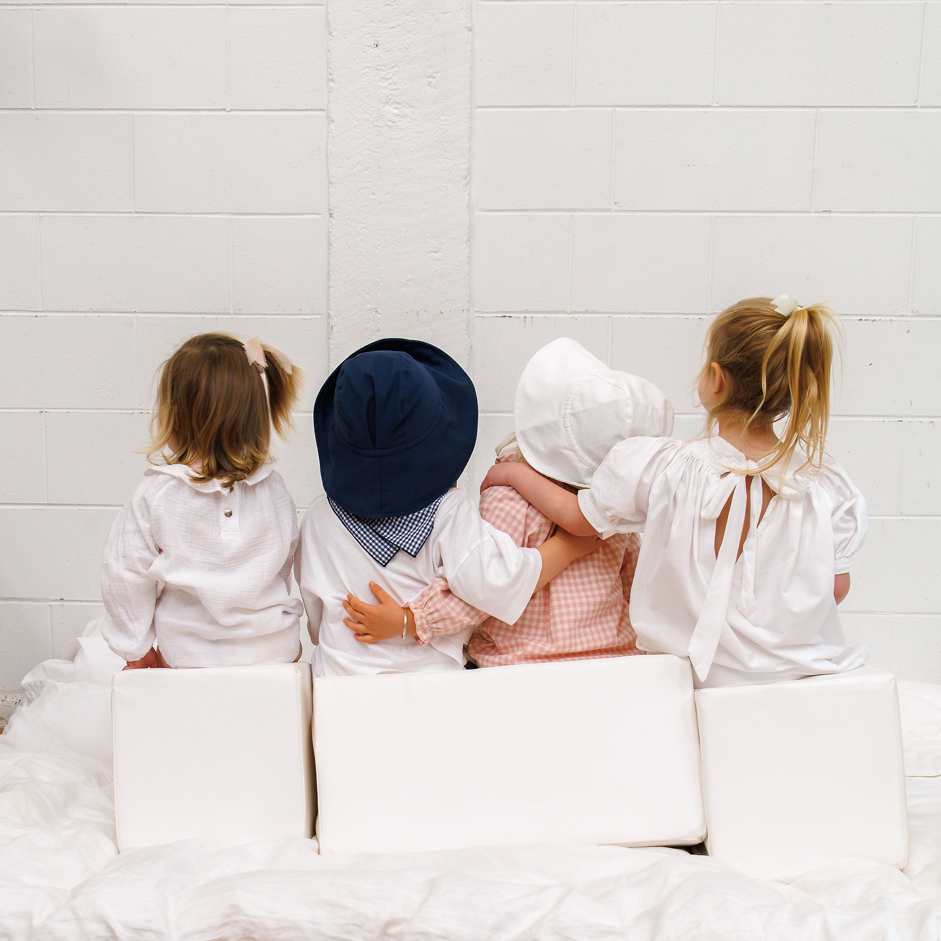 Kids together at the end of photoshoot showing the love in Wilbi outfits  - Photoshoot kids clothing 