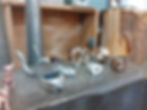 High angle view of a casting flask surrounded by tools and materials
