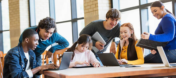 Students in the library using laptops