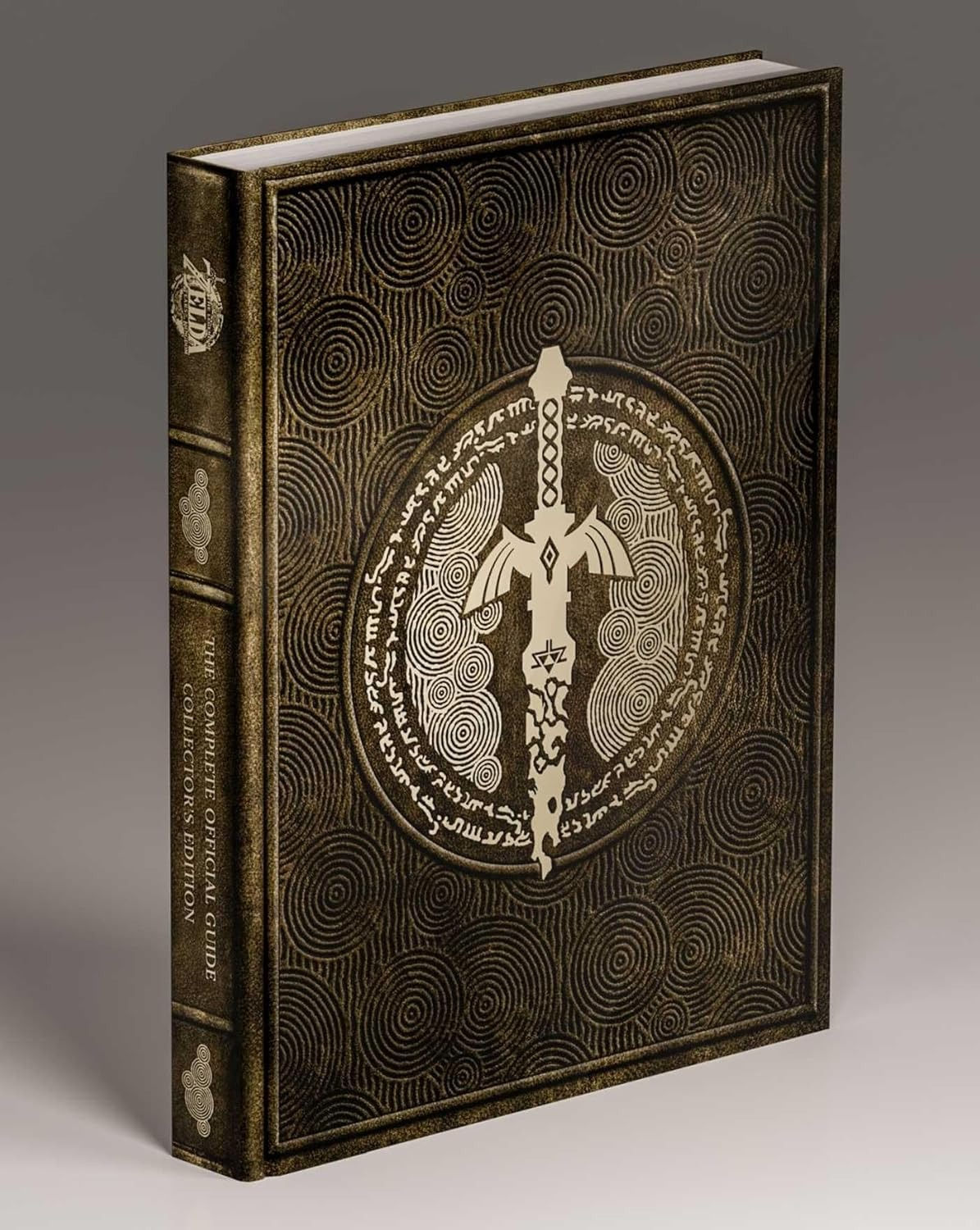 Zelda: Tears of the Kingdom Collector's Edition Guide hardcover with gold embossed Master Sword icon.