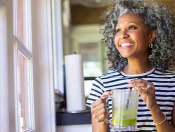 A perimenopausal or menopausal woman finding a moment of joy.