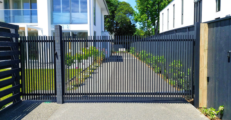Automatic Sliding Gate and Matching Pedestrian Gate with Vertical Finns on the Front of the Gate in Christchurch by Designer Gates